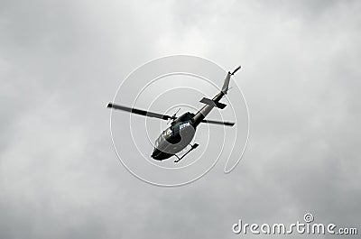 UH-1H Iroquois helicopter flying in the air. Huey taking off on maneuvers during army exercise. EUFOR in Bosnia and Herzegovina du Editorial Stock Photo