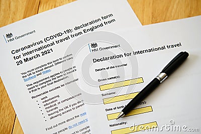 UK Declaration to Travel. Coronavirus COVID-19 Declaration form for international travel printed and placed on the desk. Selective Editorial Stock Photo