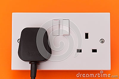 UK electrical wall socket outlet and plug Stock Photo