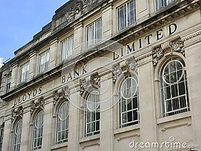 Impressive architecture of a fomer Lloyds Bank with golden lettering on exterior Editorial Stock Photo