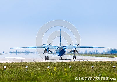 Ukraine, Borispol - MAY 22 : Military aircraft AN-26 goes to the runways at the international airport Borispol on May 22, 2015 Editorial Stock Photo