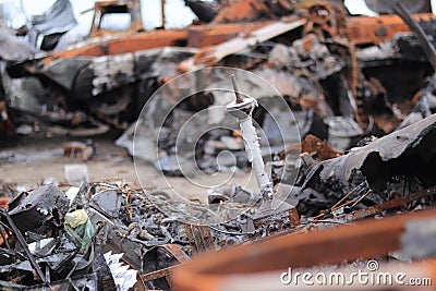 Ukraine, Bucha - 04.21.2022: Cemetery of broken military equipment Editorial Stock Photo