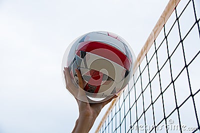 Ukraine, Chernigov July 28, 2020: Beach volleyball master class. Beautiful girl plays volleyball, hand with a ball close-up Editorial Stock Photo