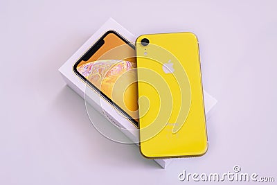 20.08.2019 Ukraine: Closeup yellow iphone xr on isolated background Editorial Stock Photo