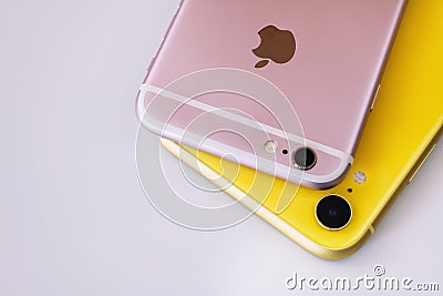 22.08.2019 Ukraine: Closeup yellow iphone xr and pink iphone 6s on isolated background Editorial Stock Photo