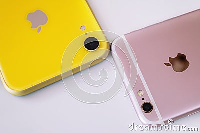 22.08.2019 Ukraine: Closeup yellow iphone xr and pink iphone 6s on isolated background Editorial Stock Photo