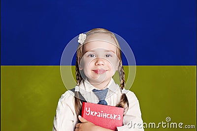 Ukraine concept with kid little girl student with red book on the Ukraine flag background. Learn ukrainian language Stock Photo