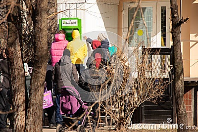 Ukraine Dnepr 24.02.2022 - People queuing for pharmacy stores and ATMs stand on the streets of the city on the first day Editorial Stock Photo
