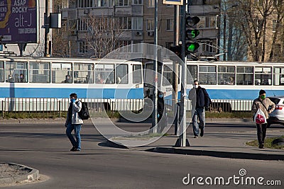 Ukraine, Dnipro - April 07, 2020. People of the city of Dnieper during the quarantine in the morning on the street, failure to Editorial Stock Photo