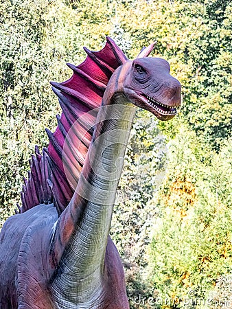 Ukraine, Khmelnitsky, October 2021. Dinosaur, amargasauruss close up with open mouth and with a long neck Editorial Stock Photo