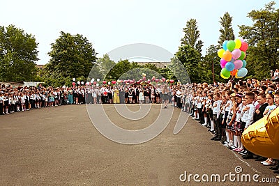 Ukraine Kiev May 2019. Graduation class go to the line in the open school yard, at the last bell festival for parents and teachers Editorial Stock Photo