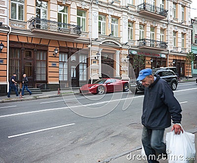 UKRAINE, KIEV - September 9,2013: Expensive supercars and poor s Editorial Stock Photo