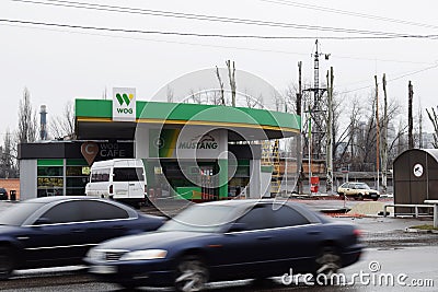 Ukraine, Kremenchug - March, 2019: Gas station WOG. Cars passing by in motion blur busy Editorial Stock Photo