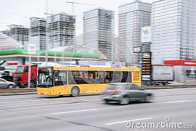 Ukraine, Kyiv - 15 January 2022: Yellow public transport bus car moving on the street. Editorial Editorial Stock Photo