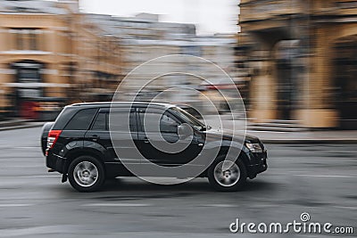 Ukraine, Kyiv - 2 June 2021: Black Suzuki Grand Vitara car moving on the street. Editorial Editorial Stock Photo