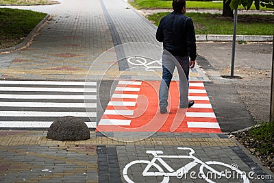 UKRAINE, LUTSK - May 10, 2020: Pedestrian walks on bike path. Editorial Stock Photo