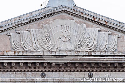 Decoration of the facade of the building in the central square. The coat of arms of Ukraine. Editorial Stock Photo