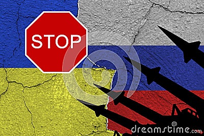 Ukraine and russia flags on old cracked wall with antiaircraft rockets silhouettes and sign `STOP` Stock Photo