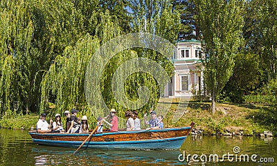Ukraine - Uman, Sofiyivka Park - June 10, 2017: Tourists float on a boat to enjoy the lively landscapes. Editorial Stock Photo