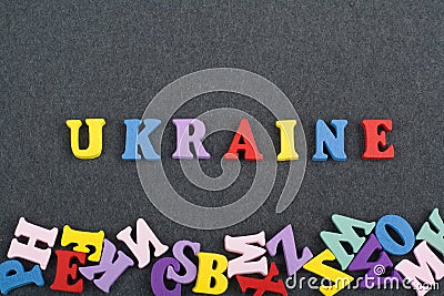 UKRAINE word on black board background composed from colorful abc alphabet block wooden letters, copy space for ad text Stock Photo