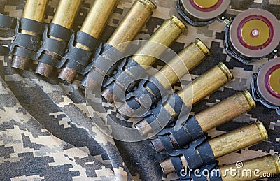 Ukrainian army fabric and machine gun belt shells lies on ukrainian pixeled military camouflage Stock Photo