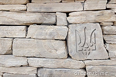 Ukrainian flag coat of arms carved on stone Stock Photo