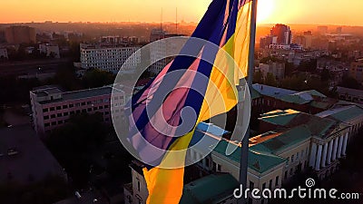 Ukrainian Flag flutters in the wind. Beautiful sunset Stock Photo