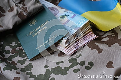 Ukrainian military ID and hryvnia on military uniform Stock Photo