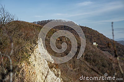 Ukrainian mountains. Lonely house in the forest and clay rock Stock Photo