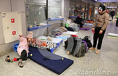 Ukrainian refugees camp out in the halls and corridors of railway station in Cracow, Poland Editorial Stock Photo
