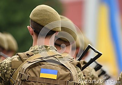 Ukrainian soldier. Ukrainian in army. Ukrainian flag on military uniform. Troops of Ukraine Editorial Stock Photo