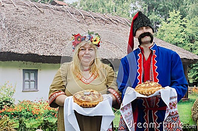 Ukrainians - man and woman, greeted guests with bread and salt Editorial Stock Photo