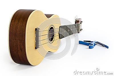 Ukulele and Capo isolated on white Clipping path included : does not include shadow. Stock Photo
