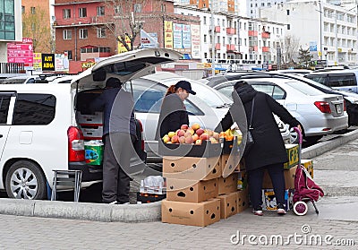 Ulaan Baatar, Mongolia - 05.13.2022: mongolian women sells fruit on the street Editorial Stock Photo