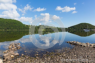 Ullswater by Pooley Bridge Lake District Cumbria rocky shore blue sky and sunshine Stock Photo