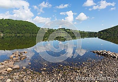 Ullswater by Pooley Bridge Lake District Cumbria rocky shore blue sky and sunshine Stock Photo