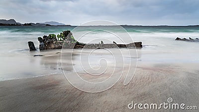 Old ship wreck in the beach at Ulsteinvik Stock Photo