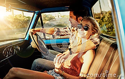 This is the ultimate road trip. a young couple out on a road trip with their truck. Stock Photo