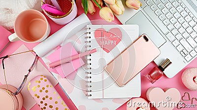 Ultra feminine workspace with touch screen PC overhead flat lay. Stock Photo