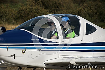 Ultralight plane flying in an airfield Editorial Stock Photo