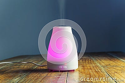Ultrasonic Essential Oil Diffuser with Purple Light Stock Photo