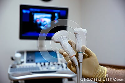 Ultrasonic investigation medical device for diagnostics in doctor hand. Hospital equipment Stock Photo