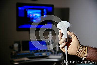 Ultrasonic investigation medical device for diagnostics in doctor hand. Hospital equipment Stock Photo