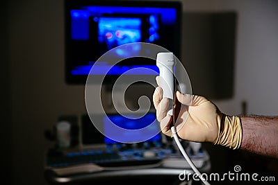 Ultrasonic investigation medical device for diagnostics in doctor hand. Hospital equipment Stock Photo