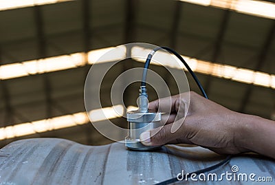 Ultrasonic test to detect imperfection or defect of wall thickness steel plate in Workshop, NDT Inspection. Stock Photo