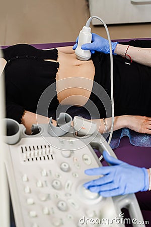 Ultrasound of abdominal organs of girl for diagnosis of liver, pancreas, gallbladder. Abdominal ultrasound for Stock Photo