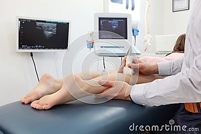 Ultrasound of girl`s knee-joint Stock Photo