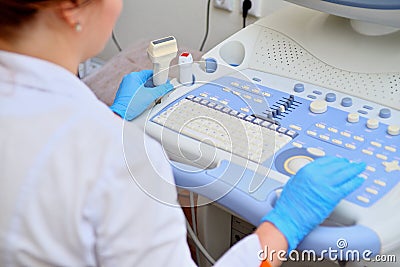 Ultrasound scanner in the hands of a doctor. Diagnostics. Sonography. Editorial Stock Photo