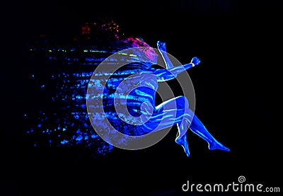 Ultraviolet black light glowing bodyart on young woman`s body. Dispersing girl on black background. Art creative concept Stock Photo