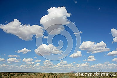 Uluru, horizon and clouds, outback Australia Editorial Stock Photo